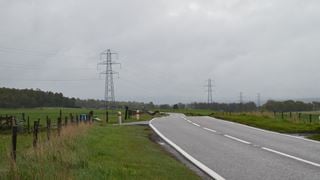 Country road with powerlines in the background