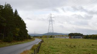 Country road with powerlines in the background 