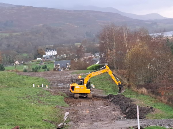 Digger carrying out works.