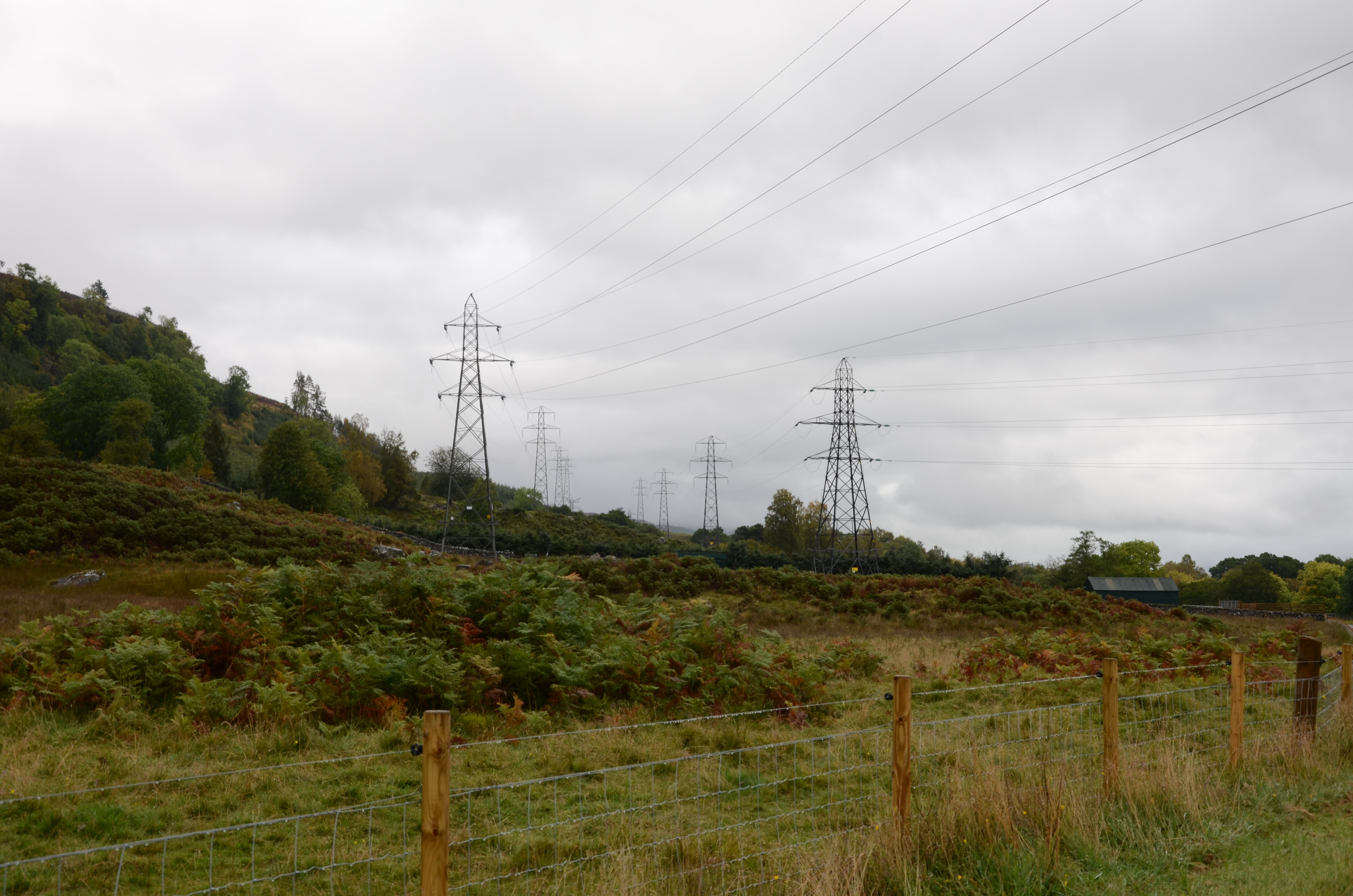 Towers on grass hillside.