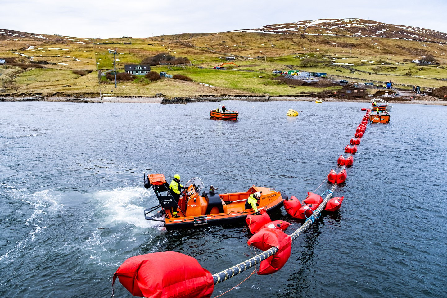 A cable is being laid in the water