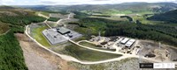 An aerial view of a substation surrounded by hills and forest. A logo in the corner states "CYBERHAWK".