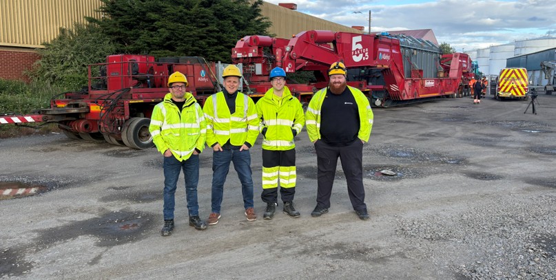 Members of the team overseeing the transformer movements alongside the specialist vehicle used to transport the Super Grid Transformer to Creag Dhubh substation