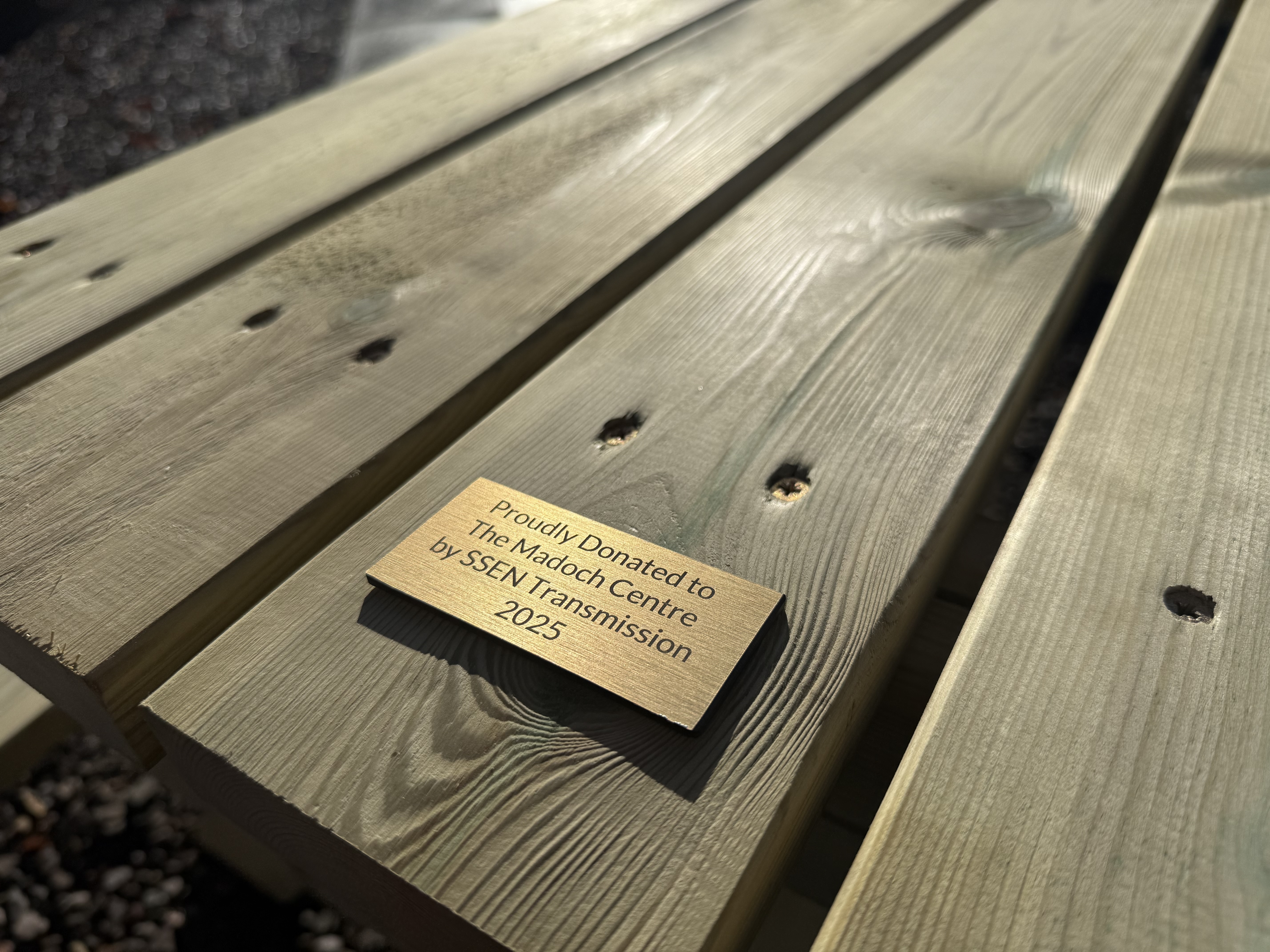 Image of plaque that is on the benches donated at The Madoch Centre 