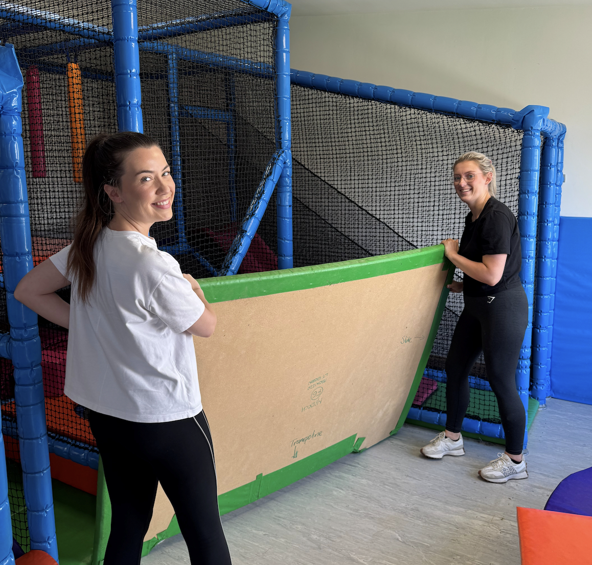 Image of colleagues volunteering at the play area in the Madoch Centre 