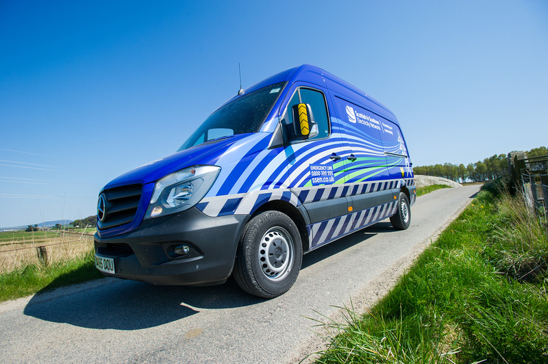 Blue SSEN van parked on a country road