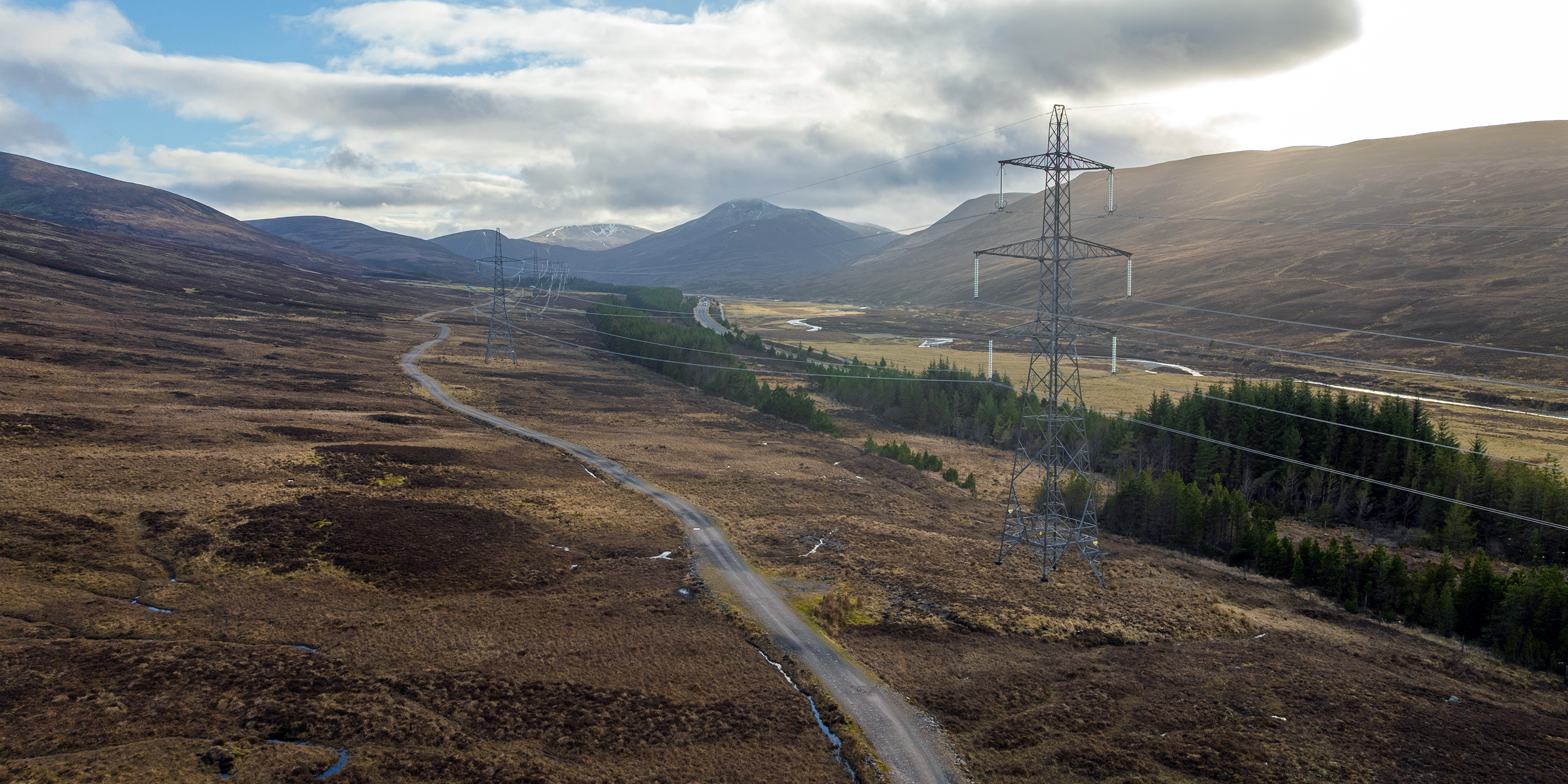 Transmission towers from the Beauly to Denny overhead line, comparable to the infrastructure proposed for the Beauly to Peterhead project.