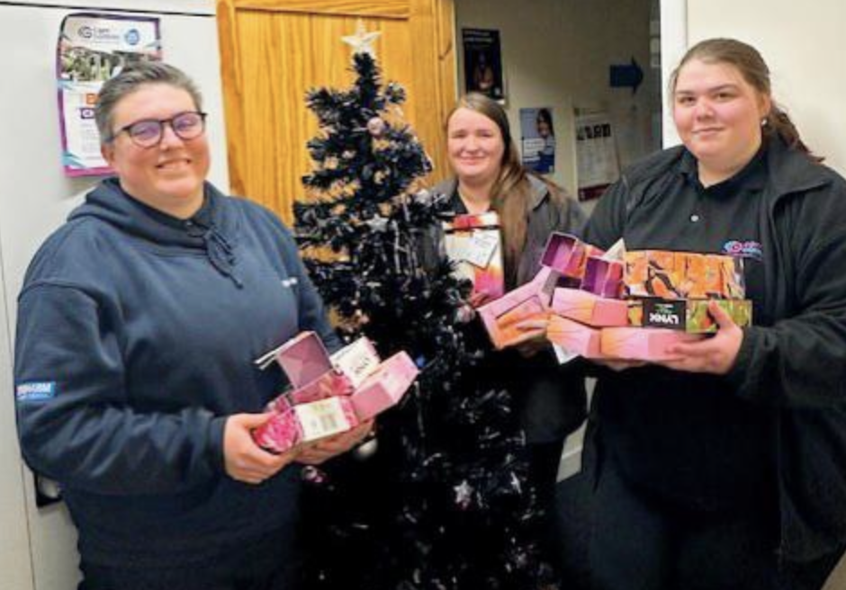 Carr Gomm donation: Image shows Laura Leslie-Sherwood, Social Impact Advisor, Balfour Beatty, hands over gifts donated by the Argyll substation projects to Carr Gomm.