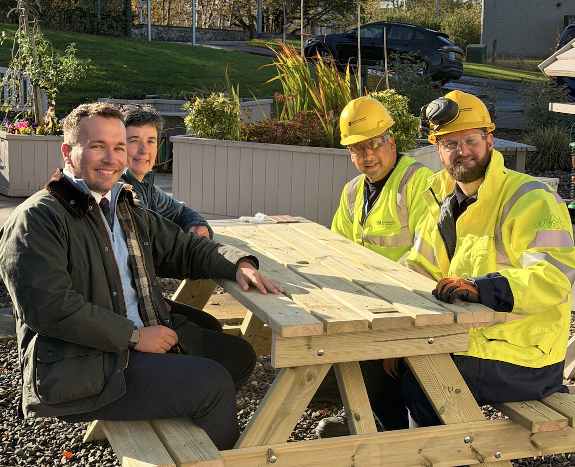 SSEN Transmission colleagues with Anthea sitting on the new benches
