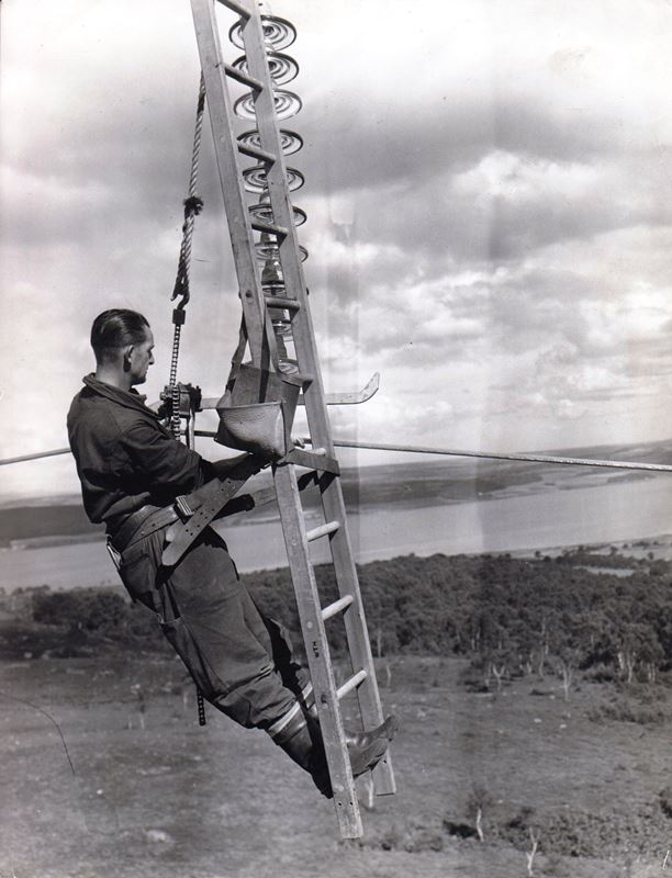 SSE Heritage archive image of a linesperson working on a 132kV overhead line in the 1950s.jpg